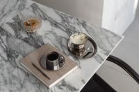 Kaboompics - Chrome Candelabra on Wooden Table in Sunlight