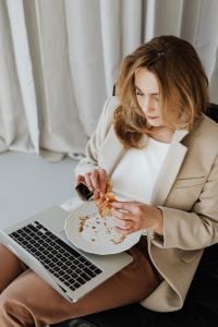 Kaboompics - Businesswoman Looking Down at Her Laptop in a Bright Office