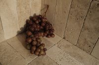 Kaboompics - Red Grapes on Stone Floor in Warm Light