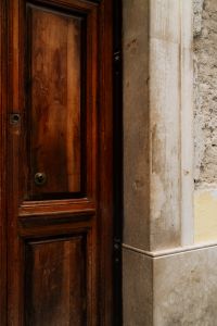 Kaboompics - Wooden Door with Textured Stone Frame