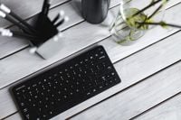 Kaboompics - Black Keyboard and Pencil Holder in a Bright Minimal Workspace