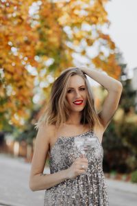 Kaboompics - Woman Posing with Champagne among Golden Autumn Leaves
