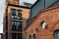 Kaboompics - Brick Loft Facade with Arched Windows and Industrial Details