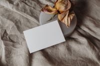 Kaboompics - Blank Card Mockup with Dark Wooden Stick and Textured Ceramic Dish