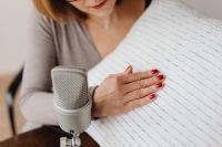 Kaboompics - Close-Up Hand Rubbing Textured Pillow beside Silver Microphone, ASMR Trigger