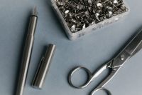 Kaboompics - Calligraphy Pen and Scissors Beside Silver Thumbtacks