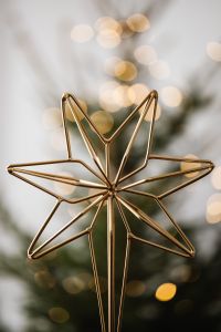 Kaboompics - Gold Star Christmas Ornament with Soft Tree Bokeh