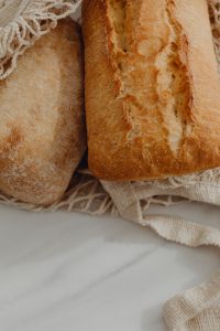 Kaboompics - Close-Up of Rustic Bread Crusts in a Mesh Shopping Bag