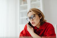 Kaboompics - Worried Woman Talking on Smartphone with Copy Space