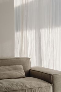 Kaboompics - Neutral Living Room Sofa and Sheer Curtains, Minimal Interior Background with Copy Space