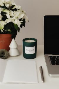 Kaboompics - White Flowers and Green Candle Desk Styling Beside Laptop