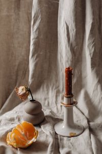 Candle Care And Palo Santo Still Life With Linen, Citrus And Dried Flowers