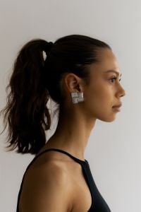 Kaboompics - Side Profile of Woman Wearing Silver Geometric Earring