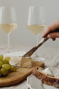 Kaboompics - Knife Beside Camembert and White Wine