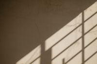 Kaboompics - Window Frame Shadows on a Warm Plaster Wall