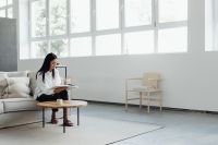 Kaboompics - Woman Enjoying a Quiet Reading Break on the Couch