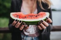 Kaboompics - Blonde woman having a healthy snack at the wooden pier