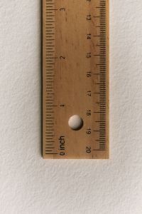 Kaboompics - Wooden Ruler with Inch and Centimeter Measurements