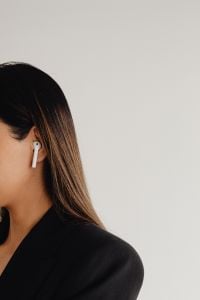 Kaboompics - Close-Up of a Wireless Earbud and Black Blazer