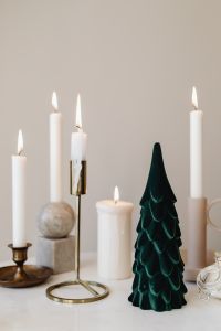 Kaboompics - Neutral Christmas Candles Beside Dark Green Tree
