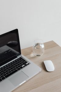 Kaboompics - Laptop, Glass of Water and Mouse on Desk with Copy Space