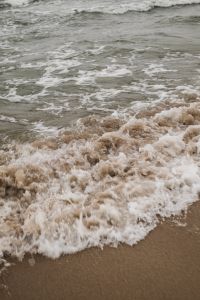 Kaboompics - Textured Sea Foam Over Wet Sand