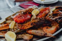 Kaboompics - Close-Up Seafood Platter with Red Prawns and Lemon