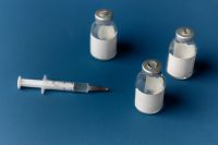 Kaboompics - Medical Vials and Syringe on Blue Background