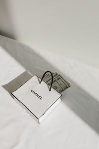Kaboompics - Stack of Dollar Bills on White Fabric