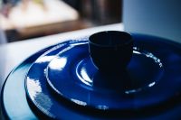 Kaboompics - Blue Ceramic Plate Stack with Dark Cup in Still Life