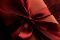 Kaboompics - Dark Red Ribbon Bow and Textured Fabric