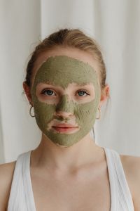 Kaboompics - Front-Facing Beauty Portrait in a Green Clay Face Mask