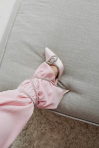 Kaboompics - Pink Satin Sleeve and Bow Heel on a Chair