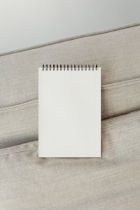 Kaboompics - Top-Bound Blank Sketchbook Mockup on Neutral Upholstery