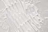 Kaboompics - Thick Cream Texture Pattern Close-Up on Neutral Background