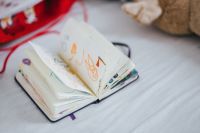 Kaboompics - Child's notebook and toys