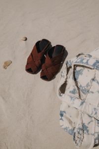Kaboompics - Brown Sandals and Floral Shirt by the Sea