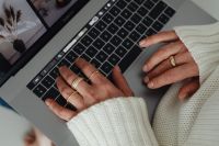 Kaboompics - Top View of Hands Typing on Laptop with Rings
