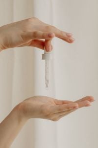 Kaboompics - Dispensing Facial Serum into an Open Palm for a Skincare Routine