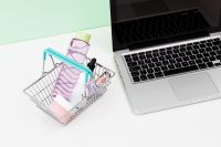 Kaboompics - Shopping Basket with Beauty Products beside Laptop