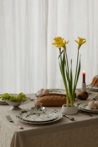 Kaboompics - Easter Table Centerpiece with Yellow Flowers and Candle
