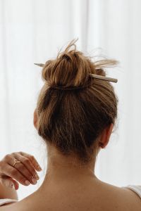Kaboompics - Messy Bun Updo with a Pencil Through the Hair