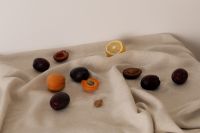 Kaboompics - Fruit Pieces and Lemon Slice on Cream Fabric