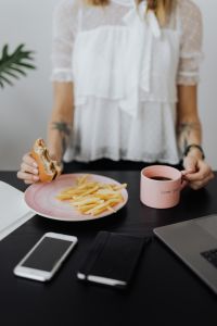 Kaboompics - Office Lunch With Burger and Fries Beside Laptop