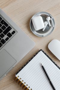 Kaboompics - Top View of Laptop, AirPods, Mouse and Notebook with Pen