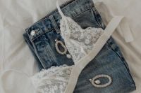 Kaboompics - White Lace Triangle Top with Jeans and Silver Jewelry