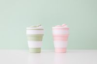Kaboompics - Pastel Collapsible Silicone Travel Mugs on Mint Green Background