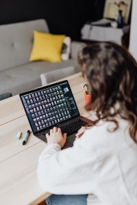 Kaboompics - Woman Using Laptop with Text on Screen