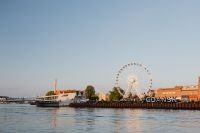 Kaboompics - Gdańsk Waterfront with AmberSky Ferris Wheel and City Sign Across the Motława River