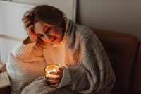 Kaboompics - Candlelit Stay-at-Home Moment Under a Blanket